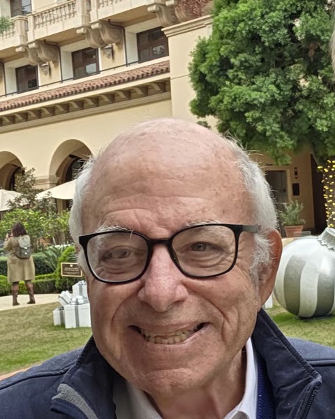 Bob Leaf, smiling, outdoors, in a Keep AI Safe Foundation jacket.
